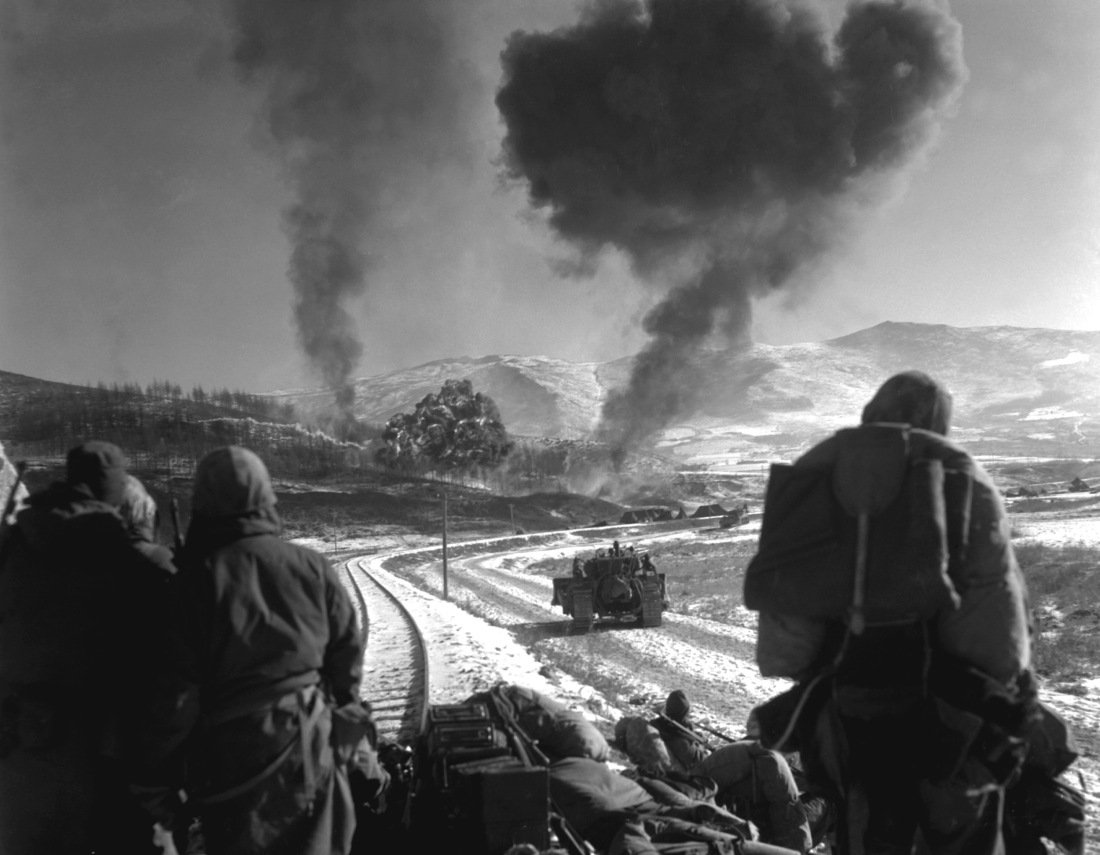 soldiers watching an explosion in korea